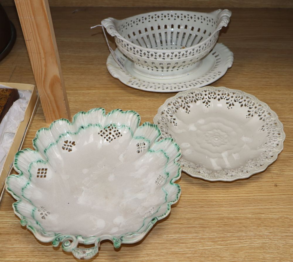 An English 18th century creamware chestnut dish and stand and a serpentine dish (4)